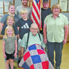 SUBMITTED PHOTOS
Leonard Froslan (center) receives a quilt from the South Central Minnesota Quilts for Veterans. With him are Froslan family members, front from left, Enid; (middle) Mabel, Oliver and Patty; and (back) Autumn and her husband Kevin and Bill.